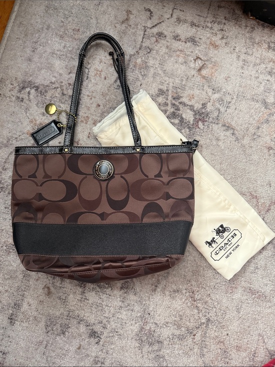 Coach Handbags - Coach Brown Signature Canvas Tote with Black Trim and Brass Accent